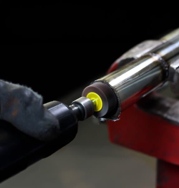 Klingspor mounted abrasive mop in use — representative manufacturer application photo